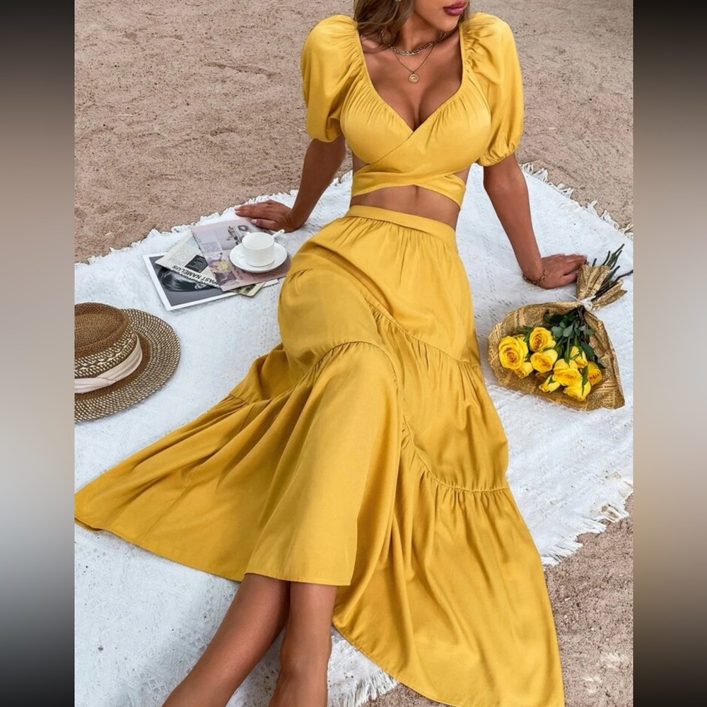 Two piece yellow beach set with tie back blouse and ruffled hem skirt